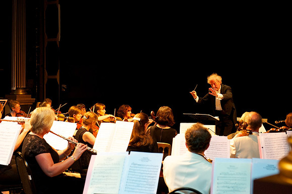 Anthony Negus , conducter with his orchestra at Great House Opera , Cotswolds UK
