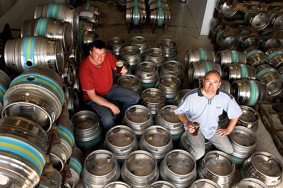 Brewers pose with their work.