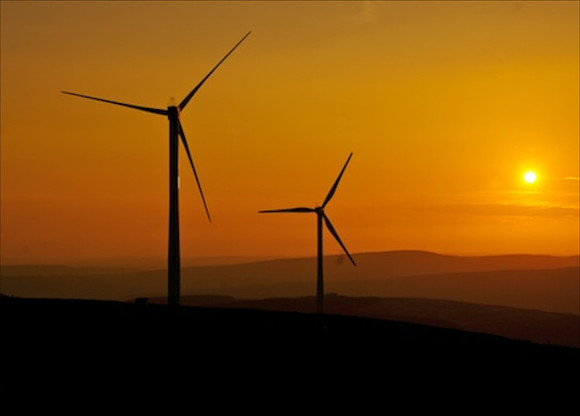 Wind turbines at sunset in South Wales valleys.